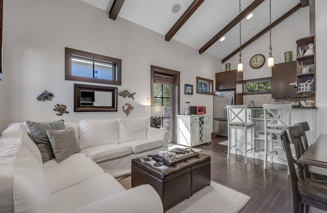 Home steps from the beach with plunge pool, gas grill, scenic balcony, & AC