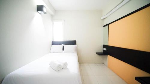 Homey and Comfy 2BR at Dian Regency Apartment By Travelio