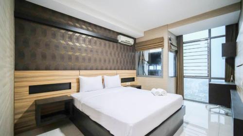 Homey and Cozy Living 2BR Apartment at Aryaduta Residence Surabaya By Travelio