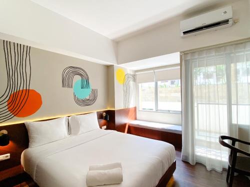 Homey Studio No Kitchen at Gateway Park LRT City Jatibening Apartment By Travelio