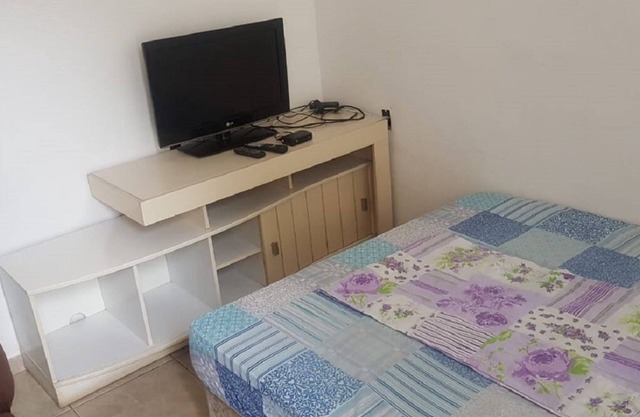 house with 2 rooms, bathroom, service area and garage