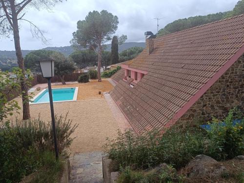 House with a large garden and a pool