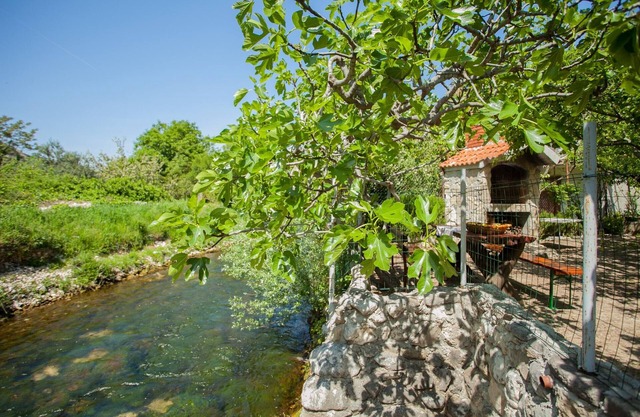 House with large garden, right next to the river