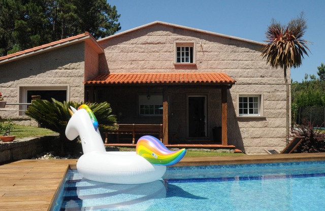 House with pool next to the beach
