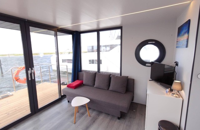 Houseboat Fjord Aquila with roof terrace in Wendtorf