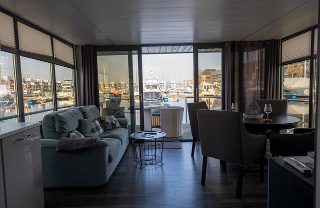 Houseboat Luv in Sonwik harbor with a view of Denmark