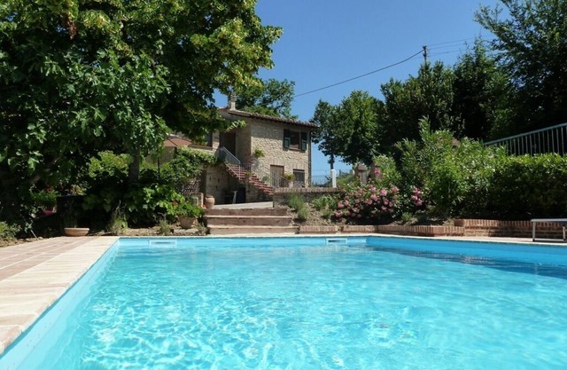 Idyllic character cottage set in landscaped garden with a private pool