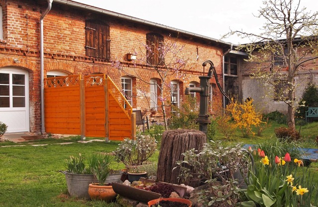 Idyllic farmhouse with a beautiful inner courtyard with a natural garden