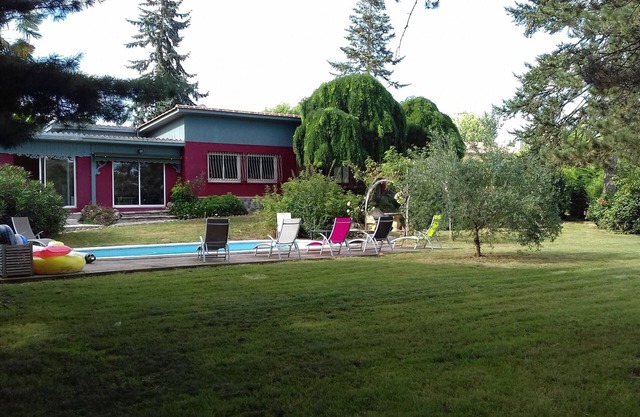 In a large enclosed park, quiet family home on the river bank,