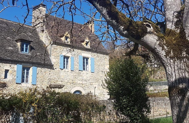 In black Perigord near the castle of Beynac, stone house with its swimming pool