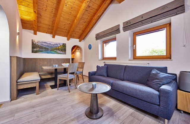Individual 40 sqm attic apartment with open roof truss and balcony access