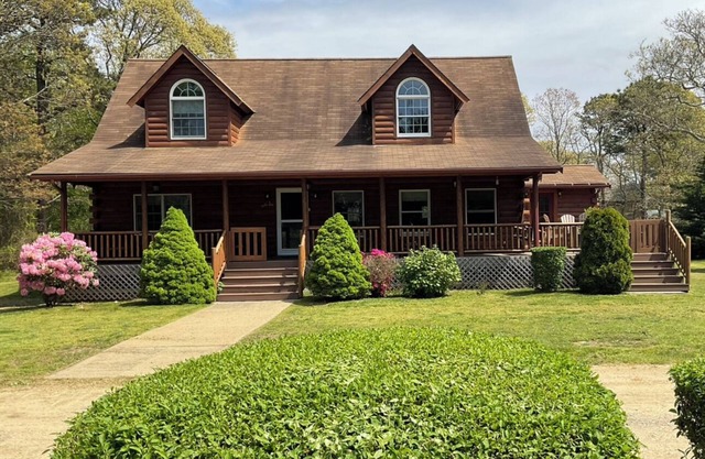 Indulge in the ultimate vacation experience at this exquisite custom log home.