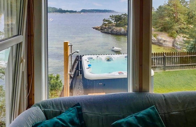 Inviting holiday home with its own beach and jetty.