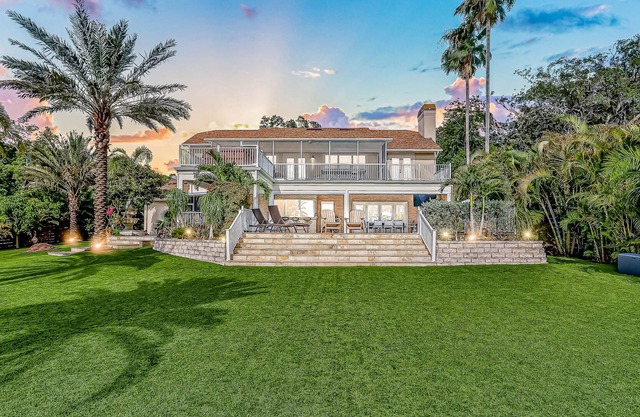 Inviting lakefront home with dock, kayaks, hot tub, pool, firepit, & W/D