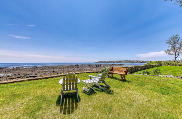Inviting oceanfront home with fireplace, firepit, & views from every room