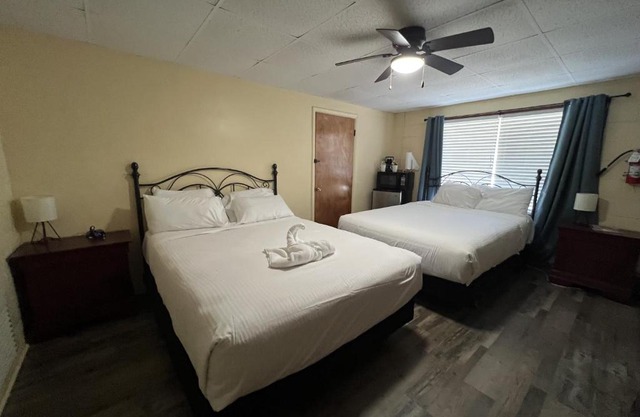 JI7, A Queen Guest Room at the Joplin Inn at entrance to the resort Hotel Room