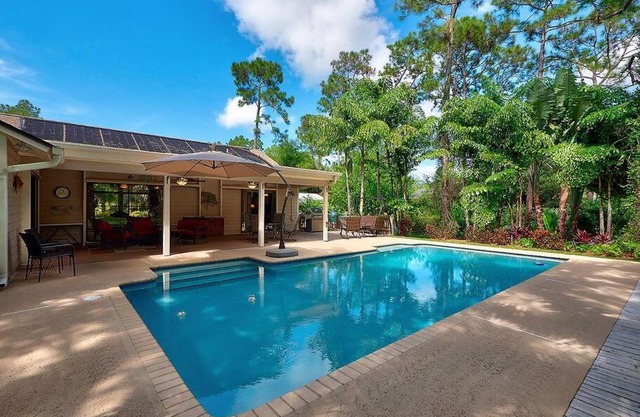 Jupiter Farms Tropical Oasis with Lush Landscaping