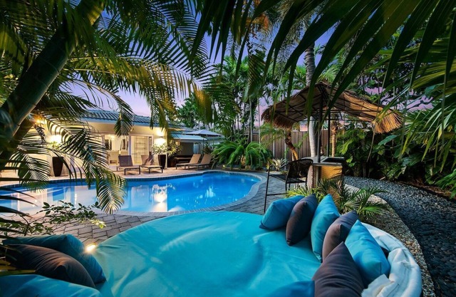 Just 10min to downtown Ft. Lauderdale & beach, this modern home offers everything a group could want for an upscale relaxing getaway. Unwind in the very private and peaceful backyard oasis, featuring a heated ($) pool, 6-person hot tub & fire pit.