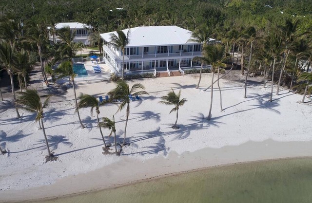 Key West Style Estate on Private Lush Beachfront Property