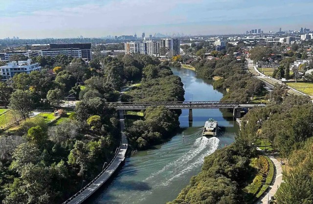 Kickback water view apartment in Parra’s new CBD with ferry boat outside