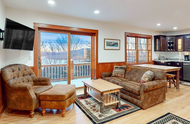 Lake and mountain view home w/ wrap-around deck & WiFi