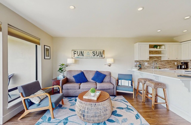 Lake and pool-view condo with beach access, 5 pools, hot tub, & balcony