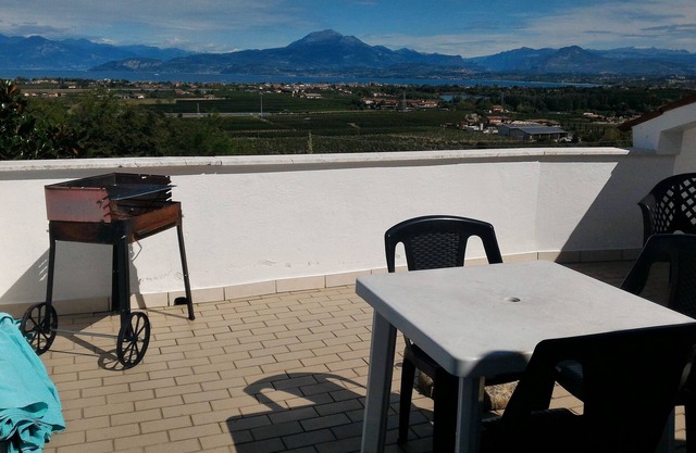 Lake Garda: penthouse garden with lake view in Peschiera GRADITI ANIMALS