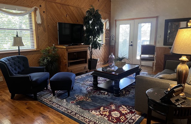 Lake view two bedroom, two bath loft, log-sided cottage with private hot tub overlooking Lake Ouachita. by RedAwning