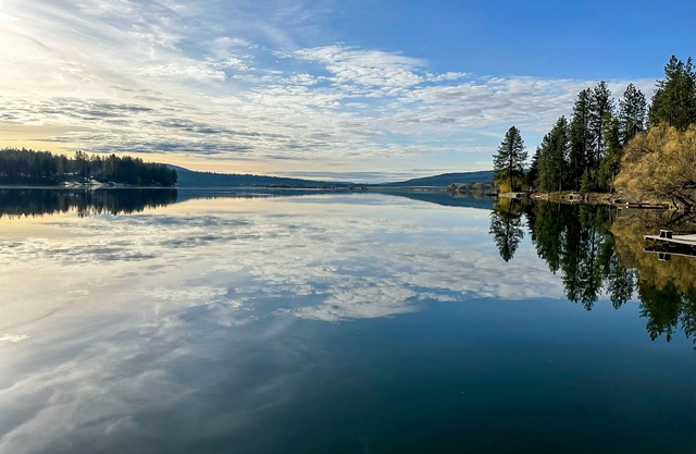 Lakefront chalet with dock, firepit, pizza oven, fireplace, & 2 primary suites