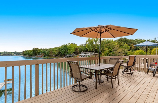 Lakefront condo with deck, amazing views, private beach access, fireplace & dock