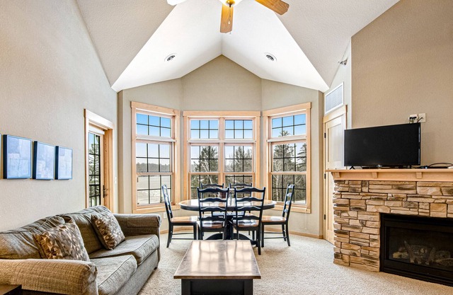 Lakefront condo with 2 balconies, loft, fireplace, W/D, indoor pool, & hot tubs