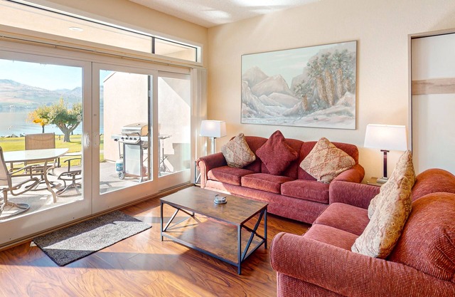 Lakefront condo with amazing views, pool, hot tub, beach access, and fireplace