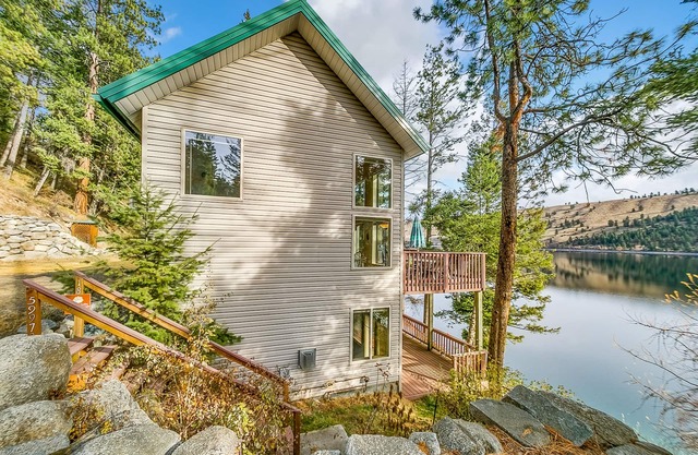 Lakefront home with private dock, 2 decks, lake views & fireplace