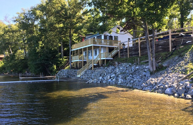 Lakeside cottage gorgeous lake/mountain views. Cable/WIFI, large decks, 30' dock