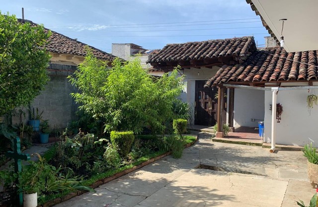 Large colonial house with garden in downtown area