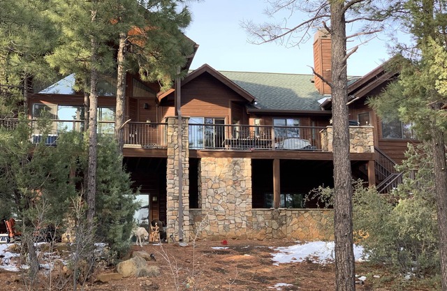 Large beautiful cabin home with hot tub under the pine trees.