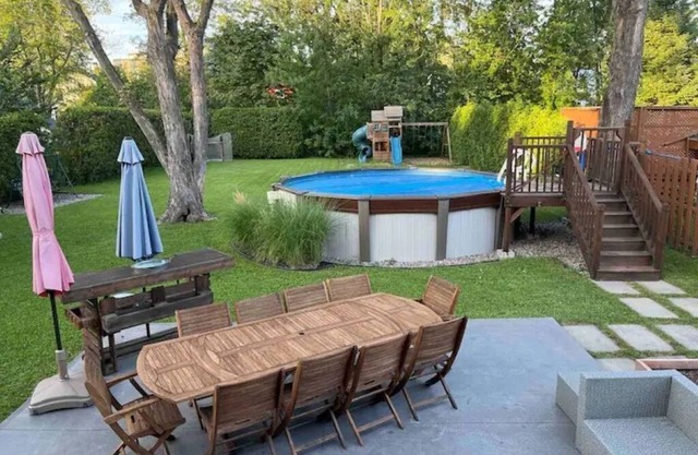Large modern house with open concept, a/c, heated swimming pool, large garden.