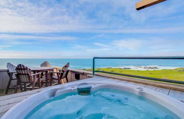 Large oceanfront home with hot tub, shared pool, & large deck - dogs welcome