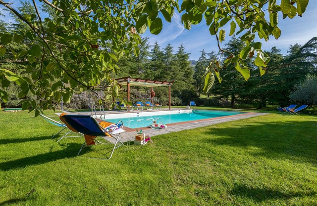 Large stone manor with 8BR and 7BA, extended grounds, large fully-equipped pool.