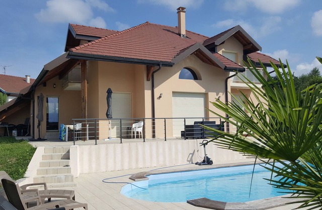 large swimming pool with large sun terraces