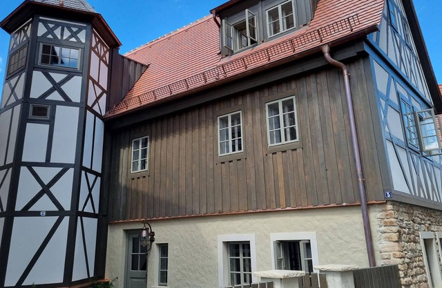 Late Gothic residential house from 1520 with hexagonal stair tower.