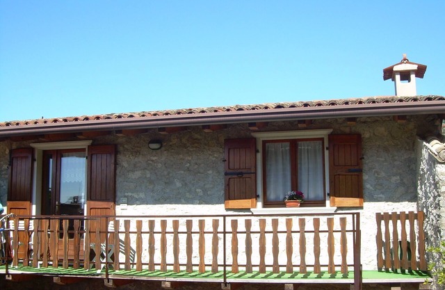 Laura apartment with balcony, garden and lake view