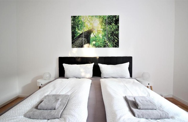 Light-flooded city apartment with balcony and garden