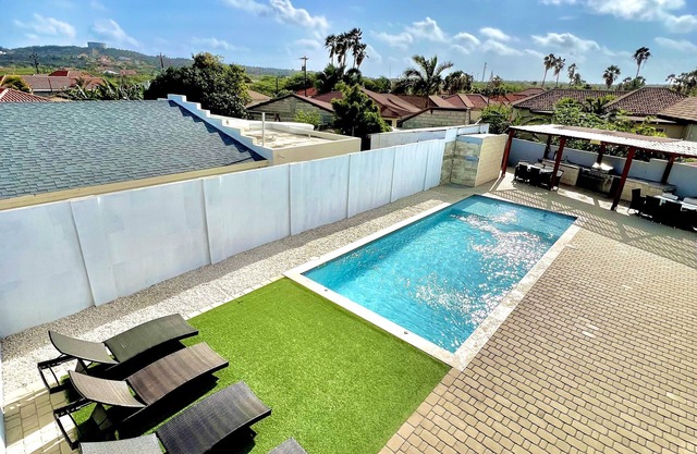 Located only minutes from Palm Beaches 3 bedroom 2 bathroom home with large pool