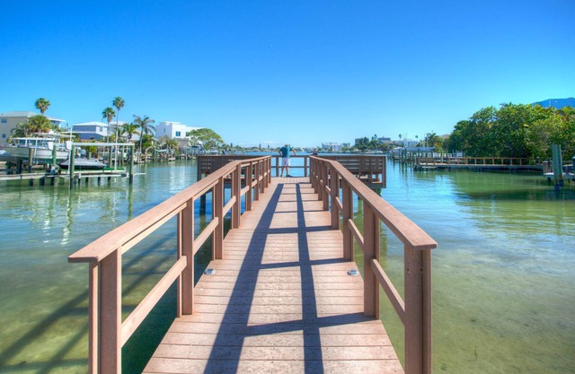 Location, Location. Charming Beachside Condo. Pool, Deck Overlooking the Bay.