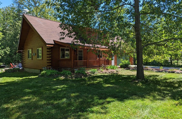 Log Cabin home on the Sturgeon River in Indian River