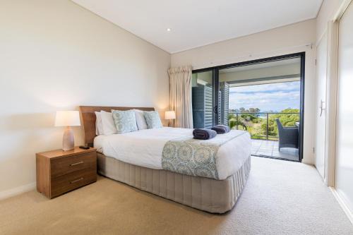 Loka Santi Penthouse 14 - Luxury Beachfront Escape with Sea View, Heated Pool, Steps from Main Beach