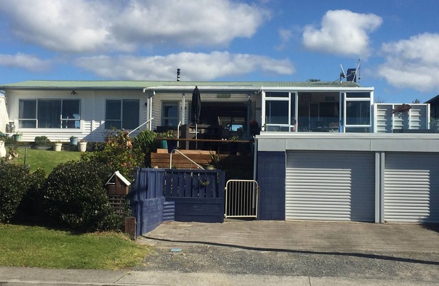 Lovely sunny home with beach views to the front and county views at the back.