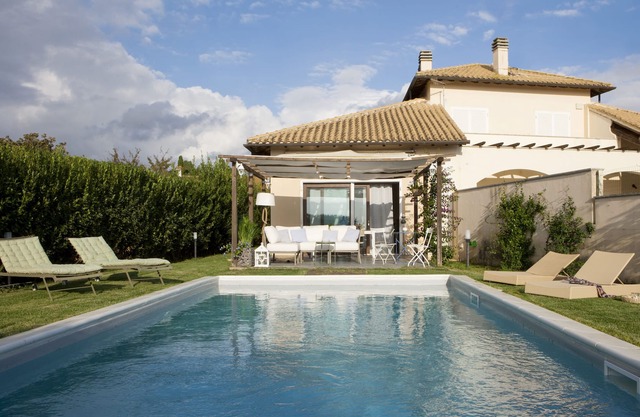 Lovely villa with private pool close to a golf course and beaches .