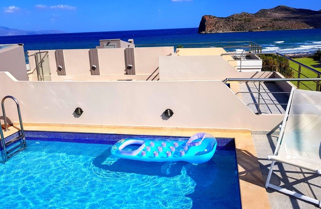 Luxurious 5-bedroom beachfront villa with a private rooftop pool and sea view